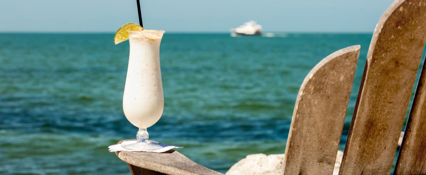 Adirondack chair and a refreshing drink with an ocean view