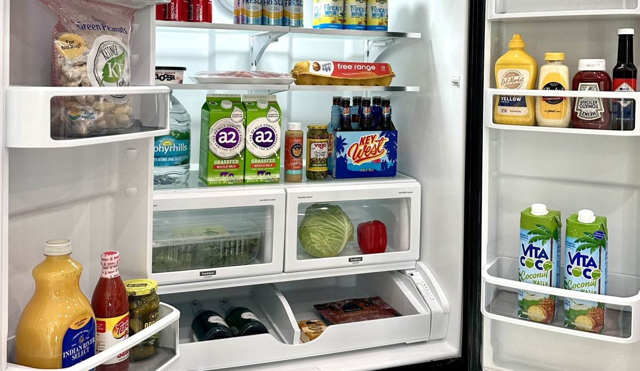 stocked fridge with groceries