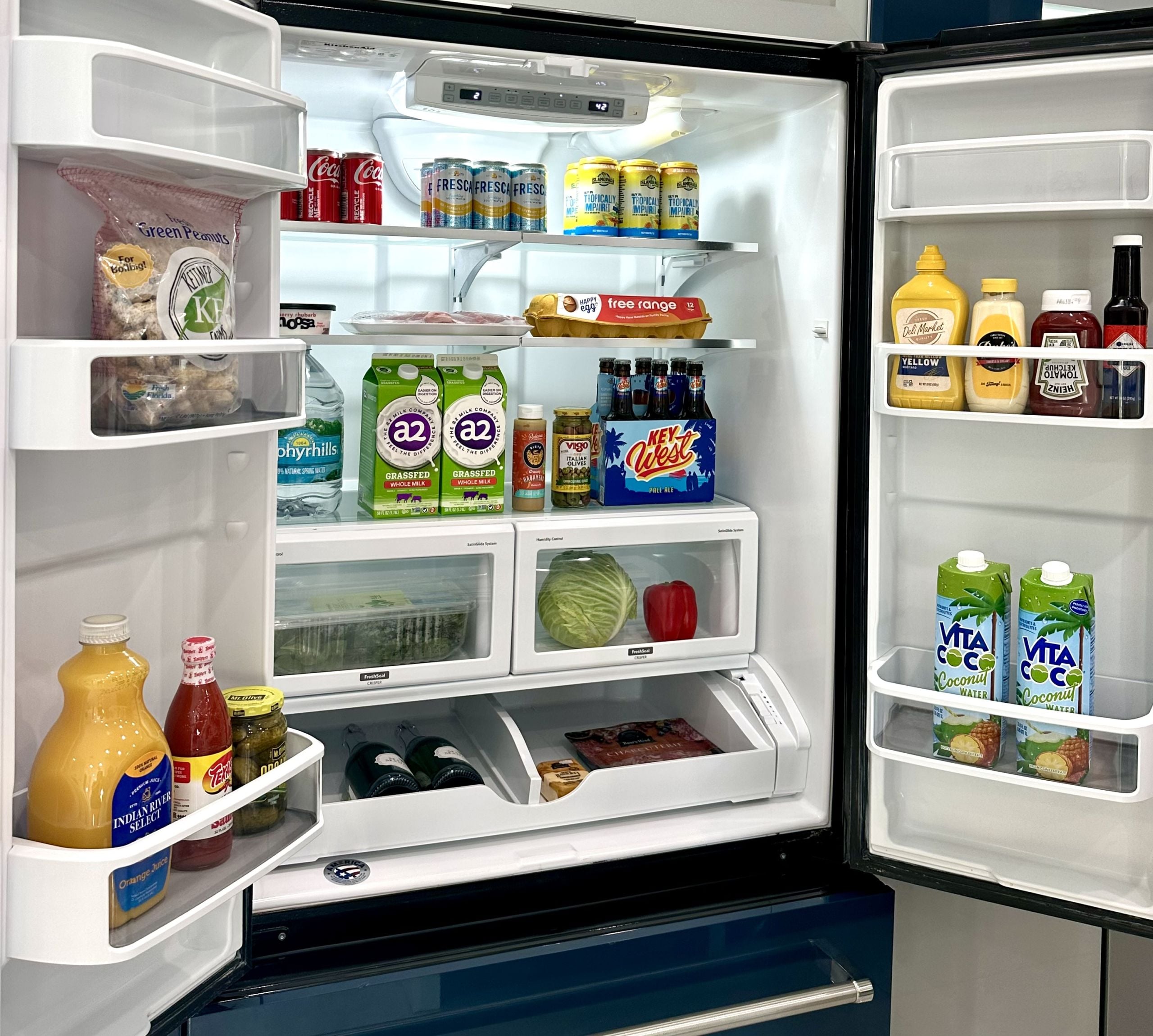 stocked fridge with groceries