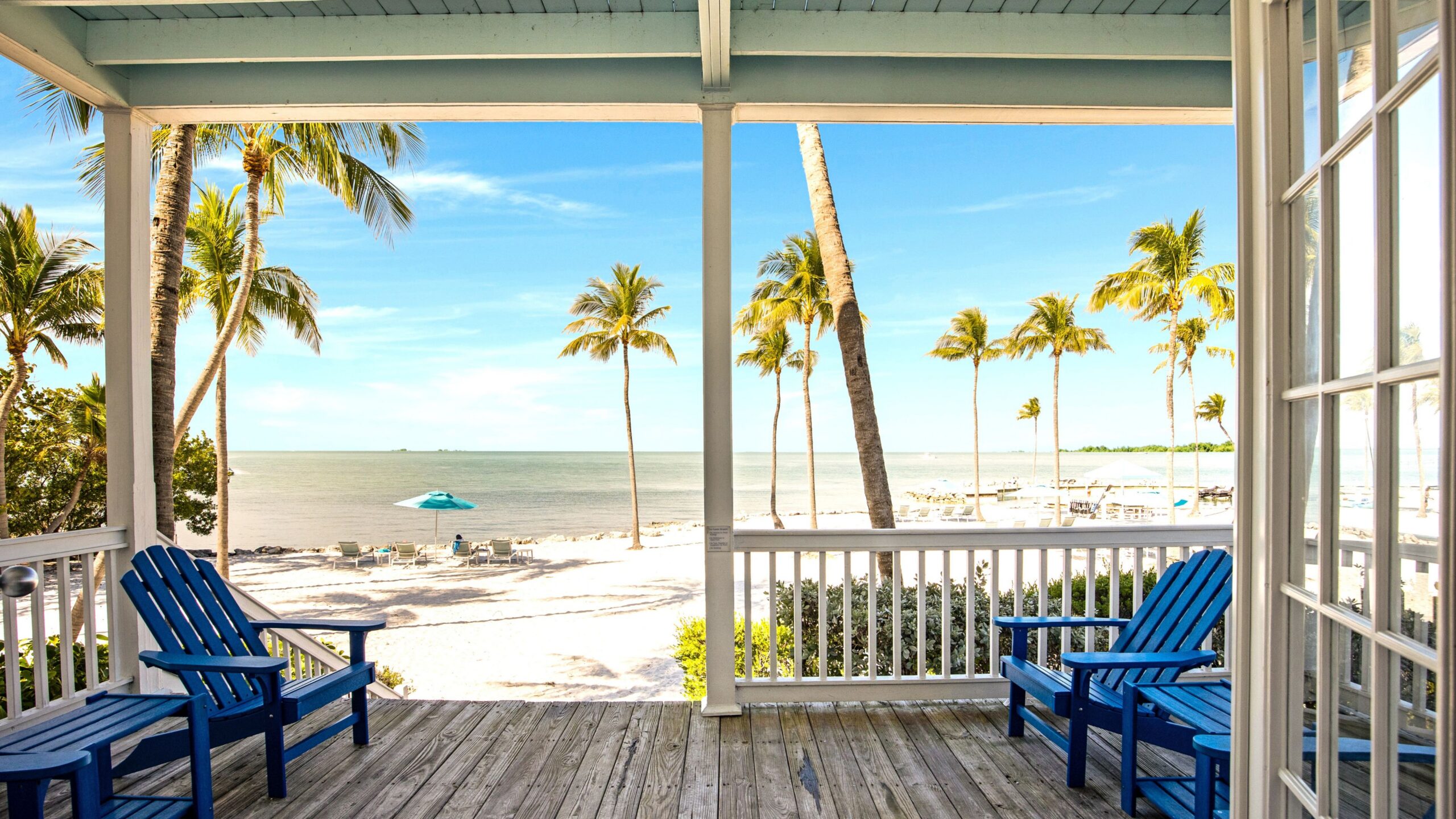 View of private beach from the patio of a 3-Bedroom Beachfront Villa at Tranquility Beach Beachfront Resort, in the Florida Keys.