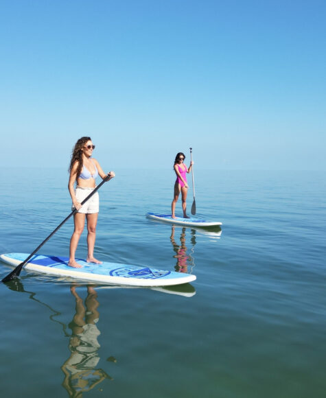 Guests using the standup paddleboards on the calm water at Tranquility Bay Beachfront Resort, in the Florida Keys.