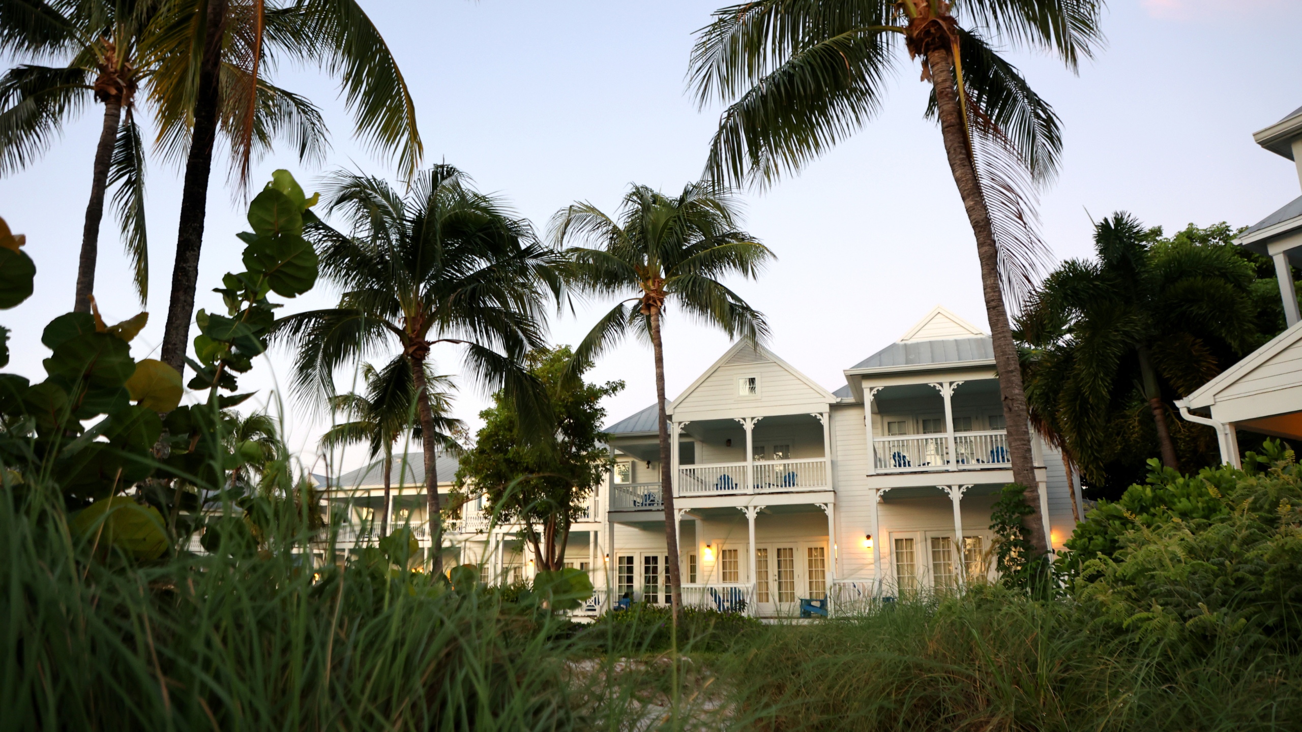 Villa exterior at dusk at Tranquility Bay Beachfront Resort, in Marathon, FL.