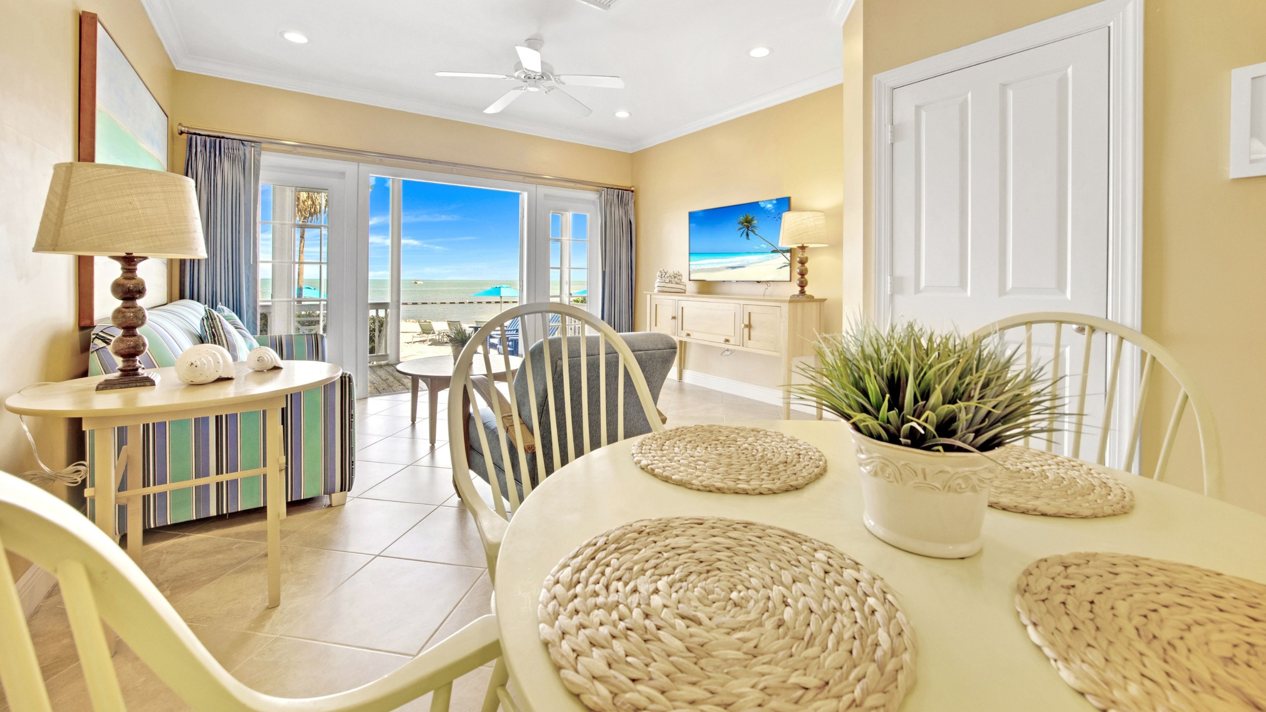 Open concept living and dining area of a 2-Bedroom Beachfront Villa at Tranquility Bay Beachfront Resort in the Florida Keys.
