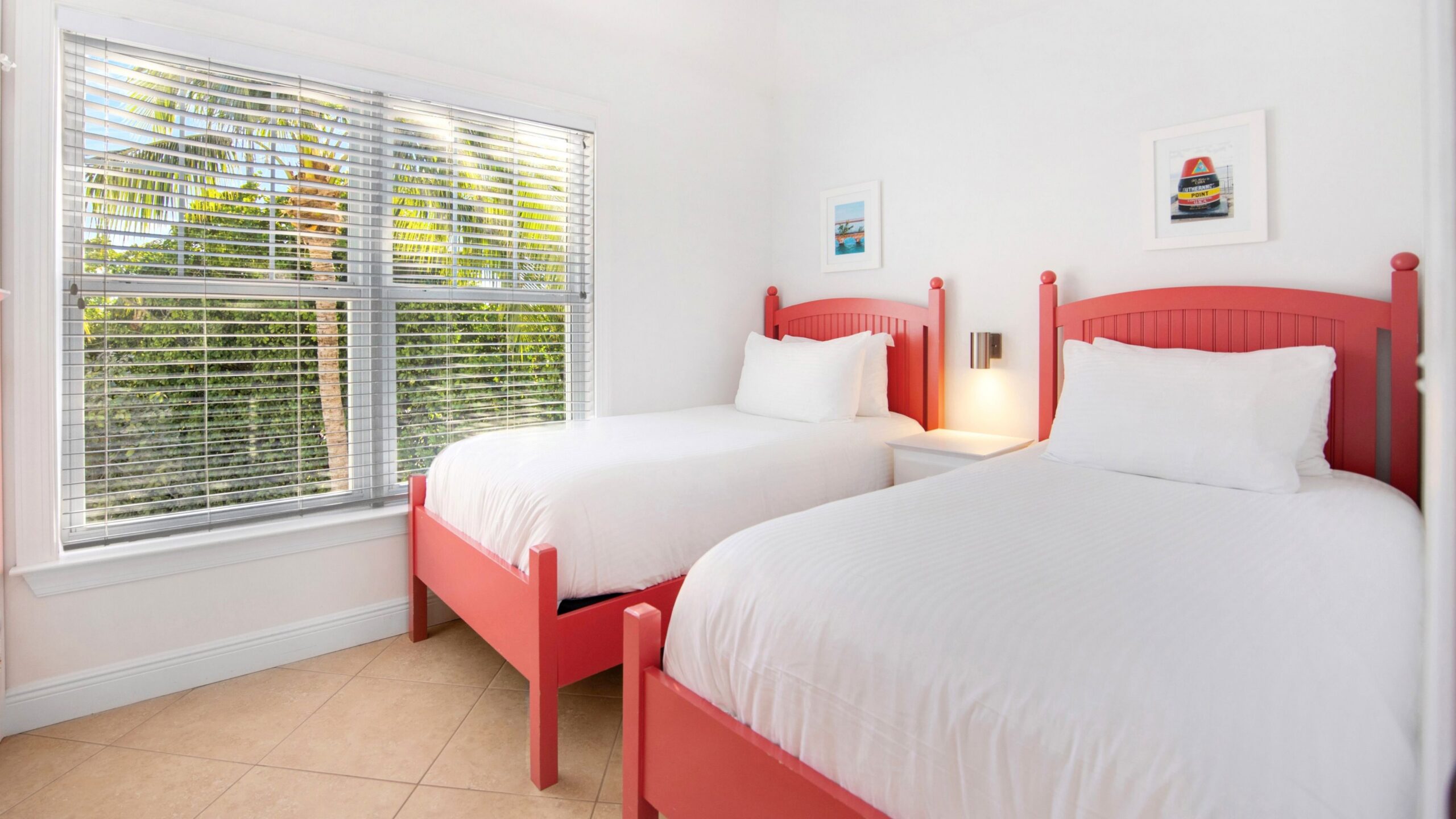 view of bedroom in 2-bedroom water view villa, featuring two double beds
