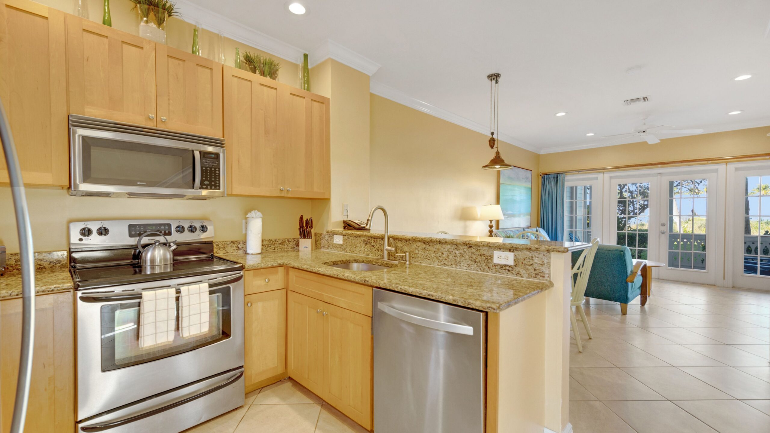 view of kitchen and living room in the 2-bedroom water view villa