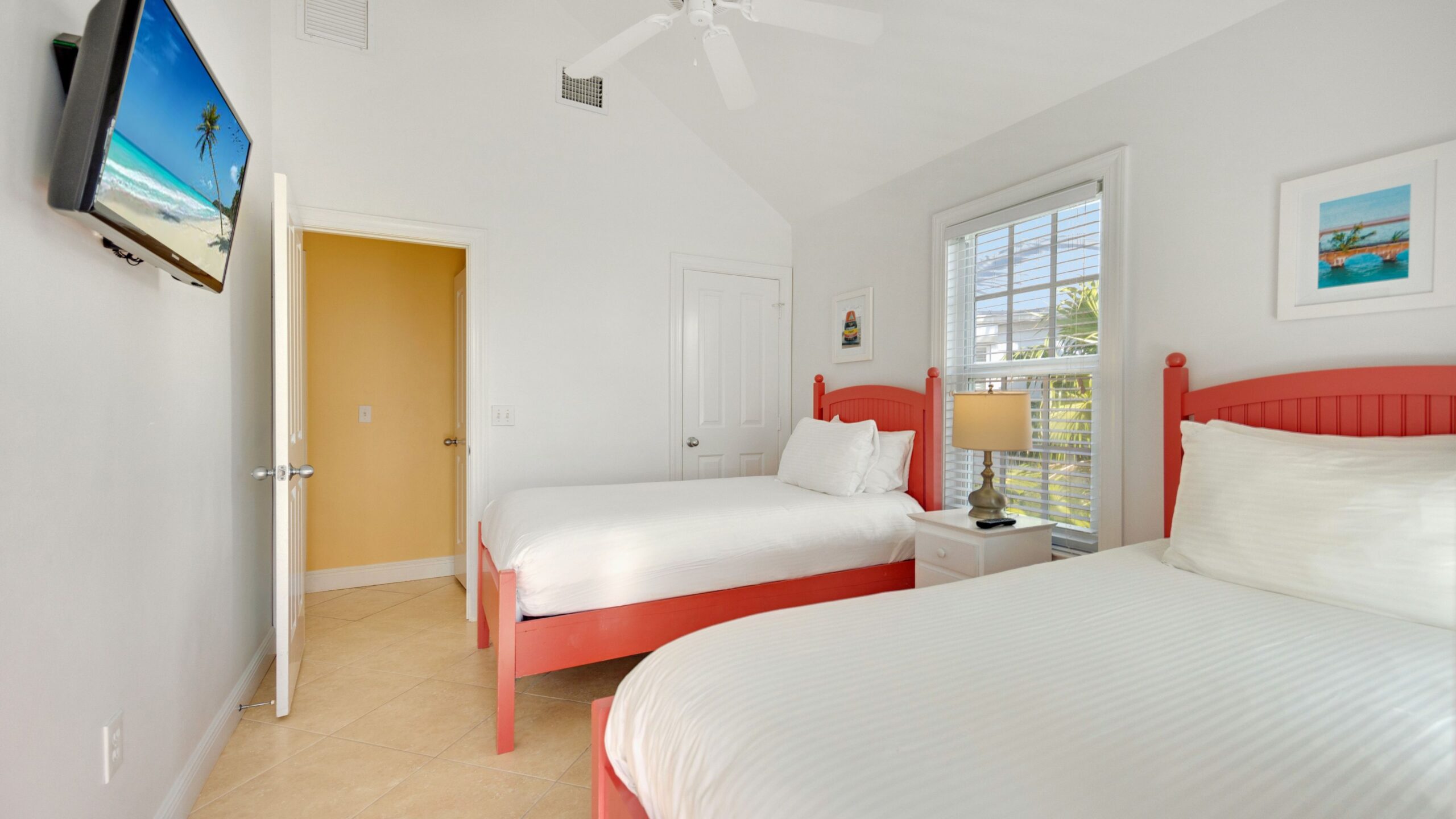 A room with two twin beds in a 3-Bedroom Waterfront Villa at Tranquility Beach Beachfront Resort, in the Florida Keys.