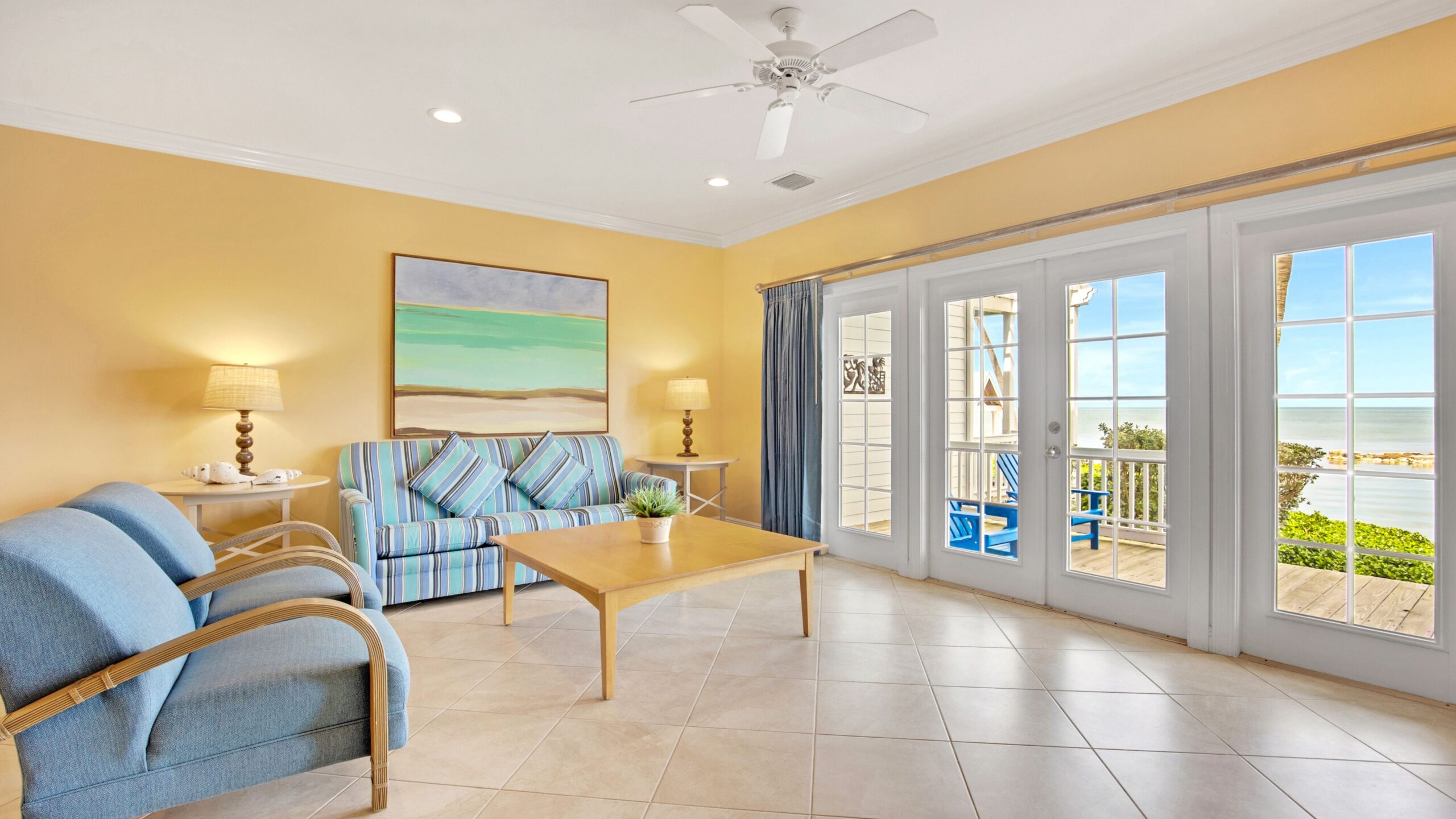 The living room and view from a 3-Bedroom Waterfront Villa at Tranquility Beach Beachfront Resort, in the Florida Keys.