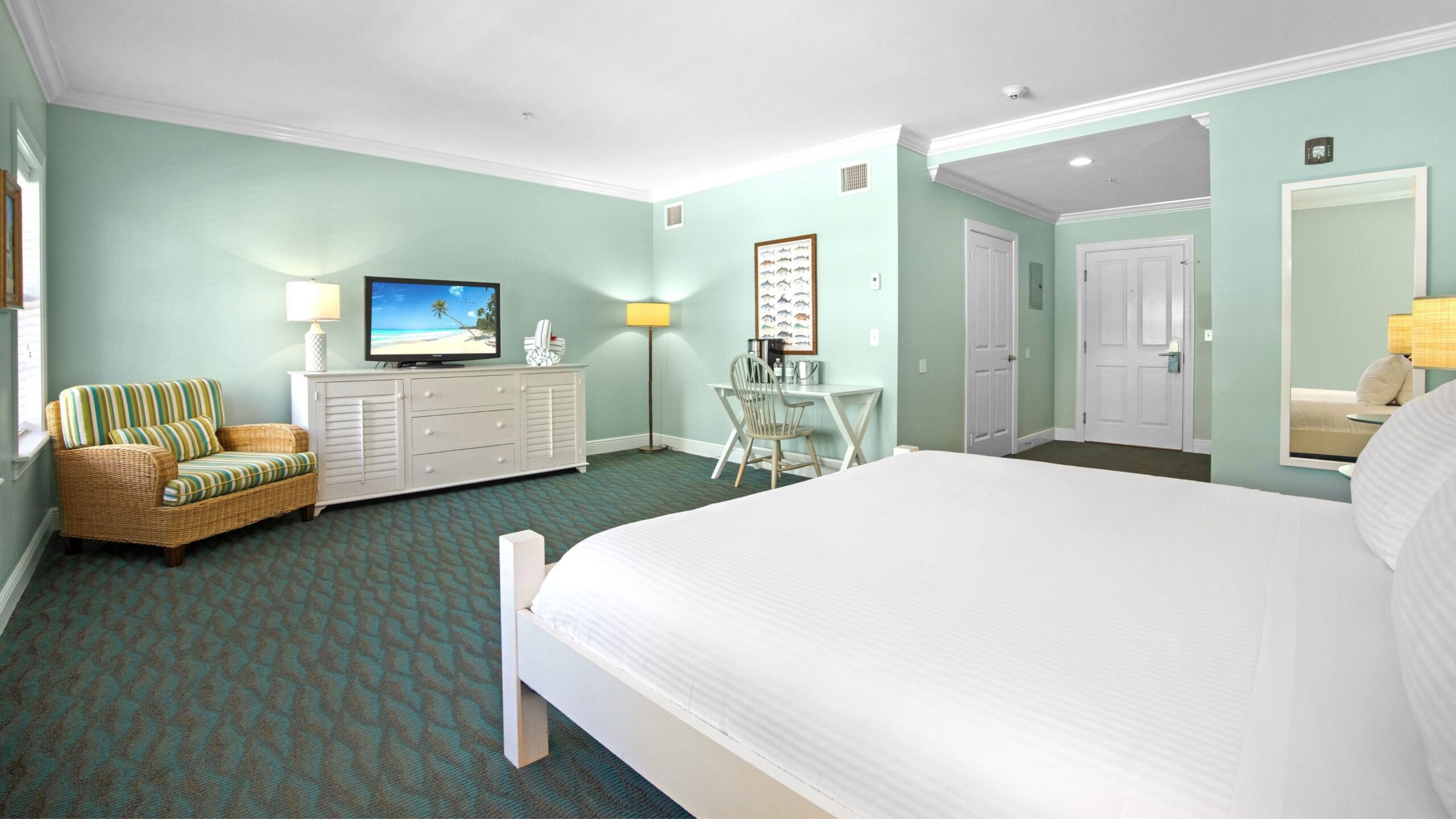 Bedroom of an Accessible Ground-Floor Tropical Garden King Hotel Room at Tranquility Bay Beachfront Resort, in the Florida Keys.