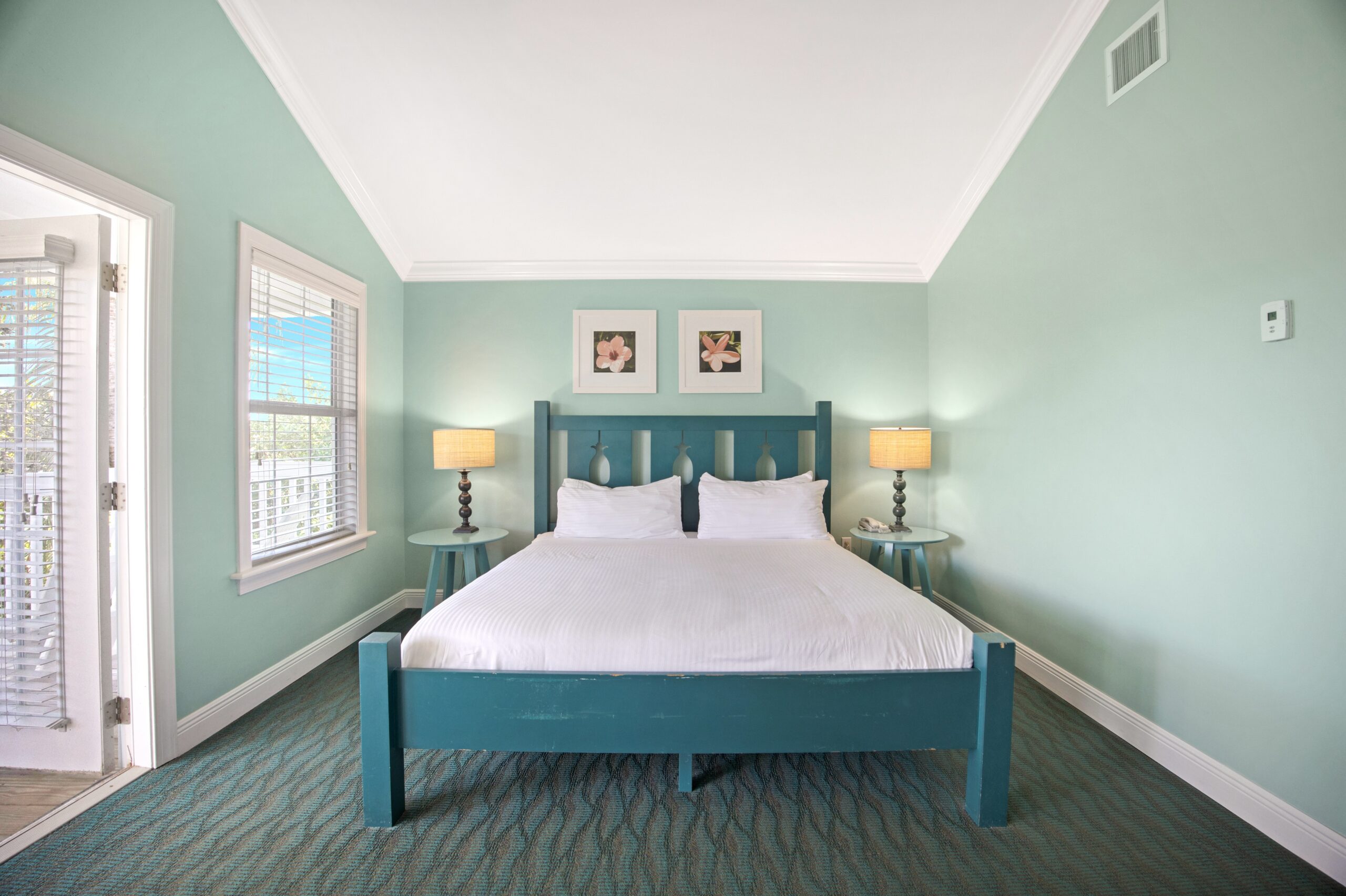 Interior view of king size bed in the Tropical Garden King Room