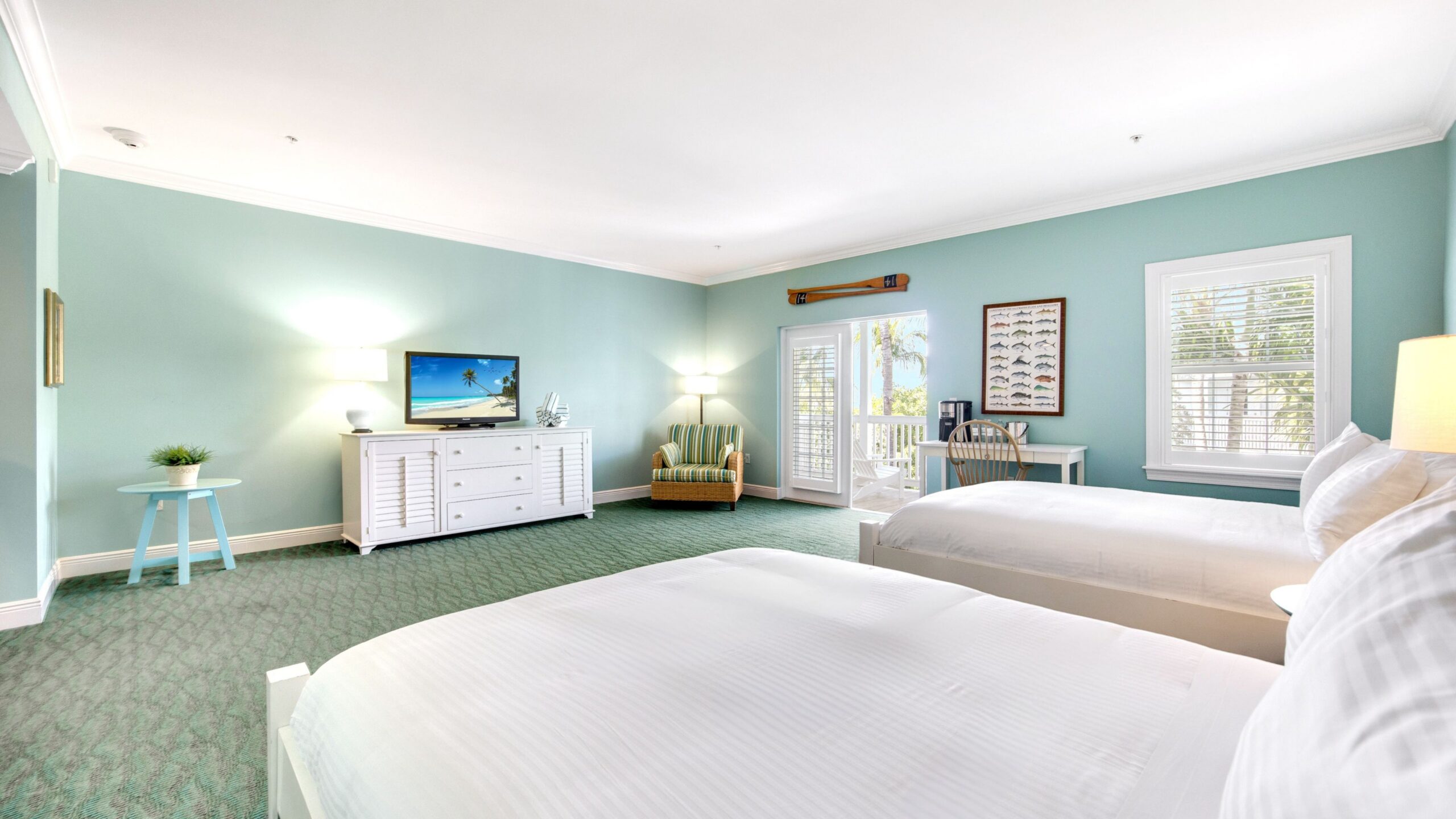 Bedroom of a Superior Double Queen Hotel Room at Tranquility Bay Beachfront Resort, in the Florida Keys.