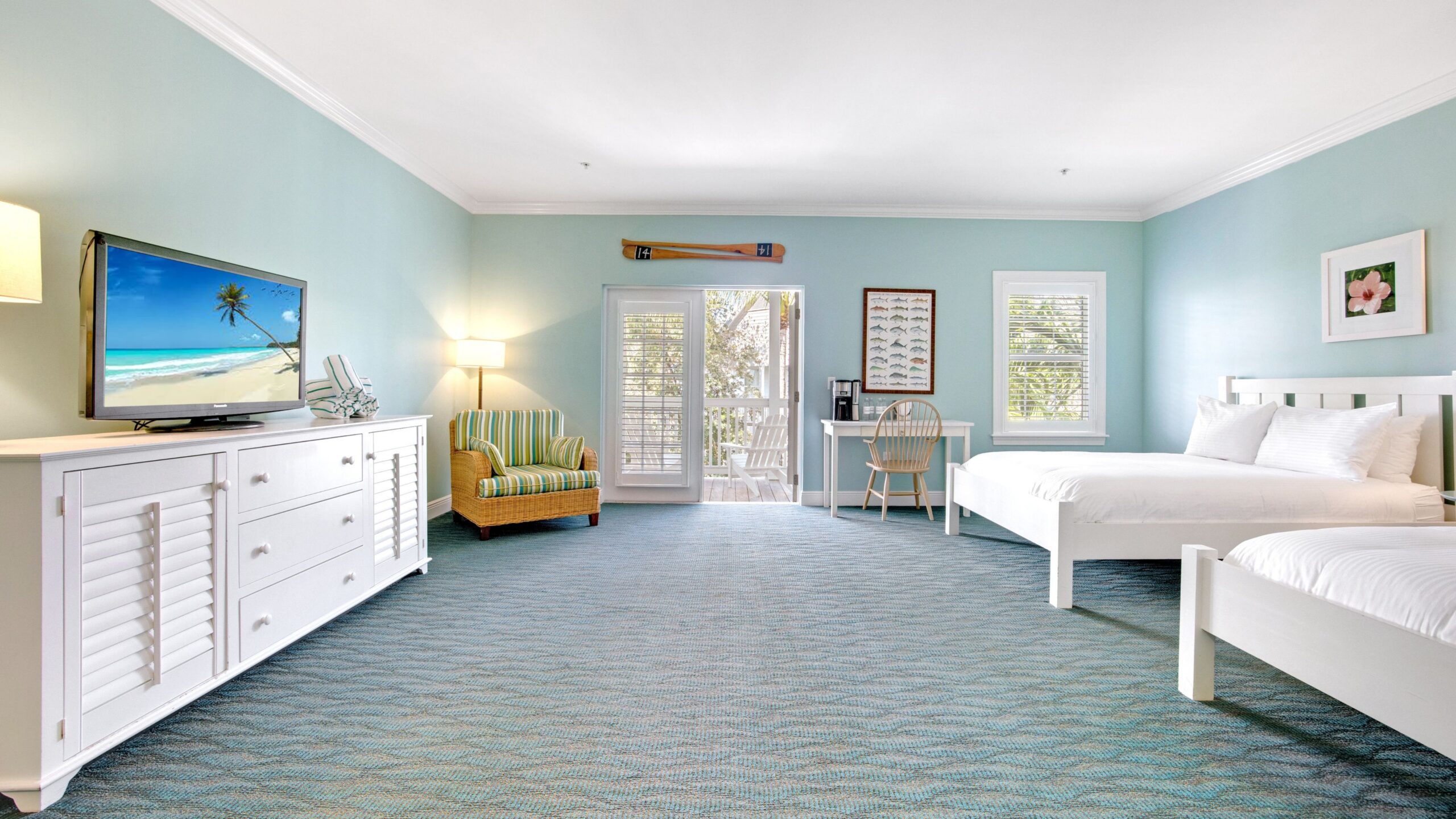 Bedroom of a Superior Double Queen Hotel Room at Tranquility Bay Beachfront Resort, in the Florida Keys.