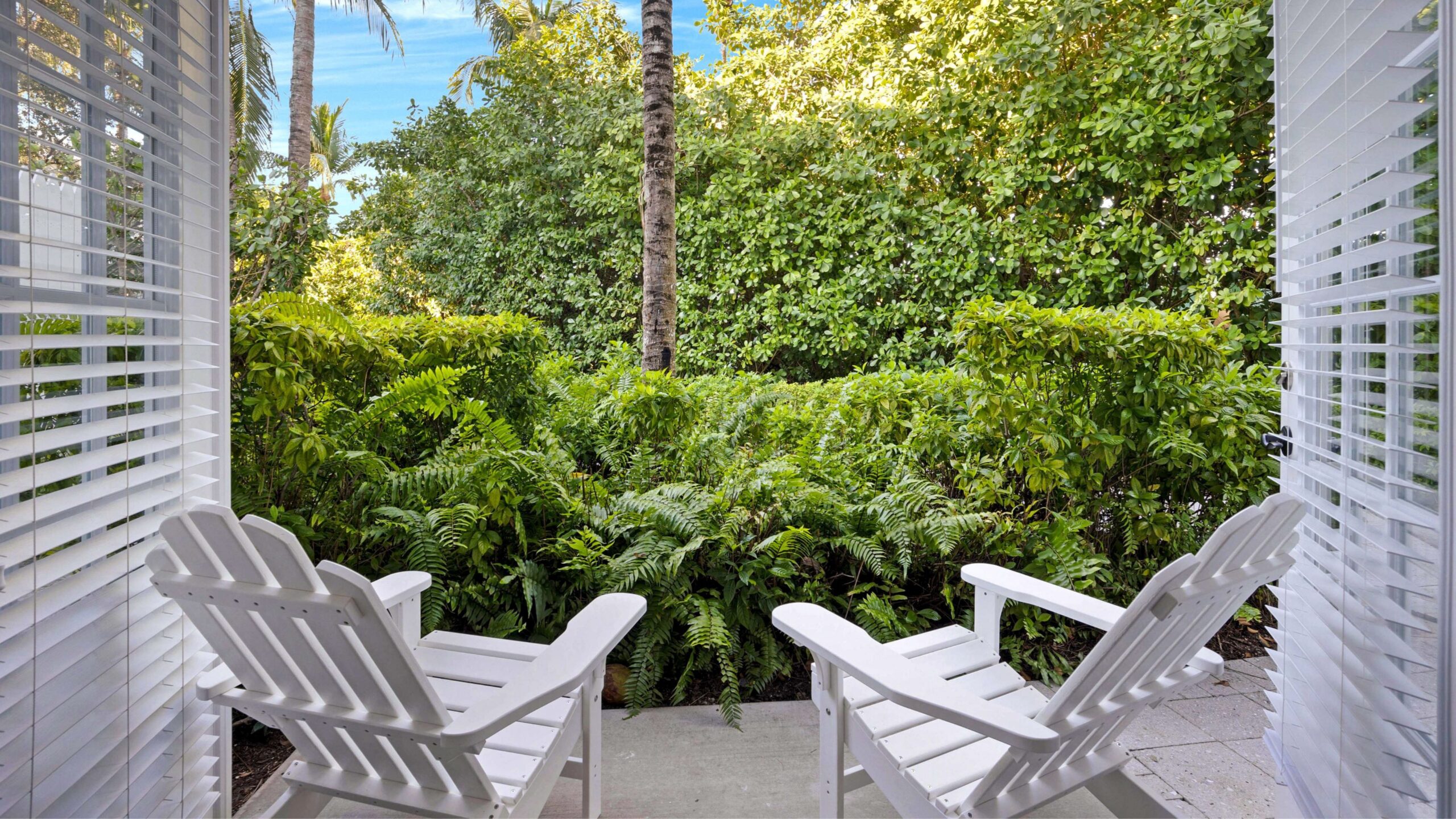 Front porch garden view from a Tropical Garden Double Queen Hotel Room at Tranquility Bay Beachfront Resort, in the Florida Keys.