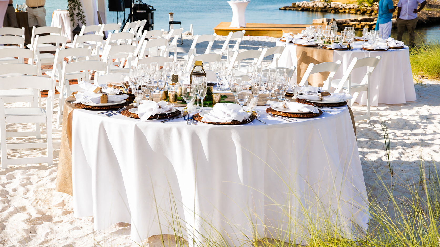 View of set table for an event on the beachfront at Tranquility Bay