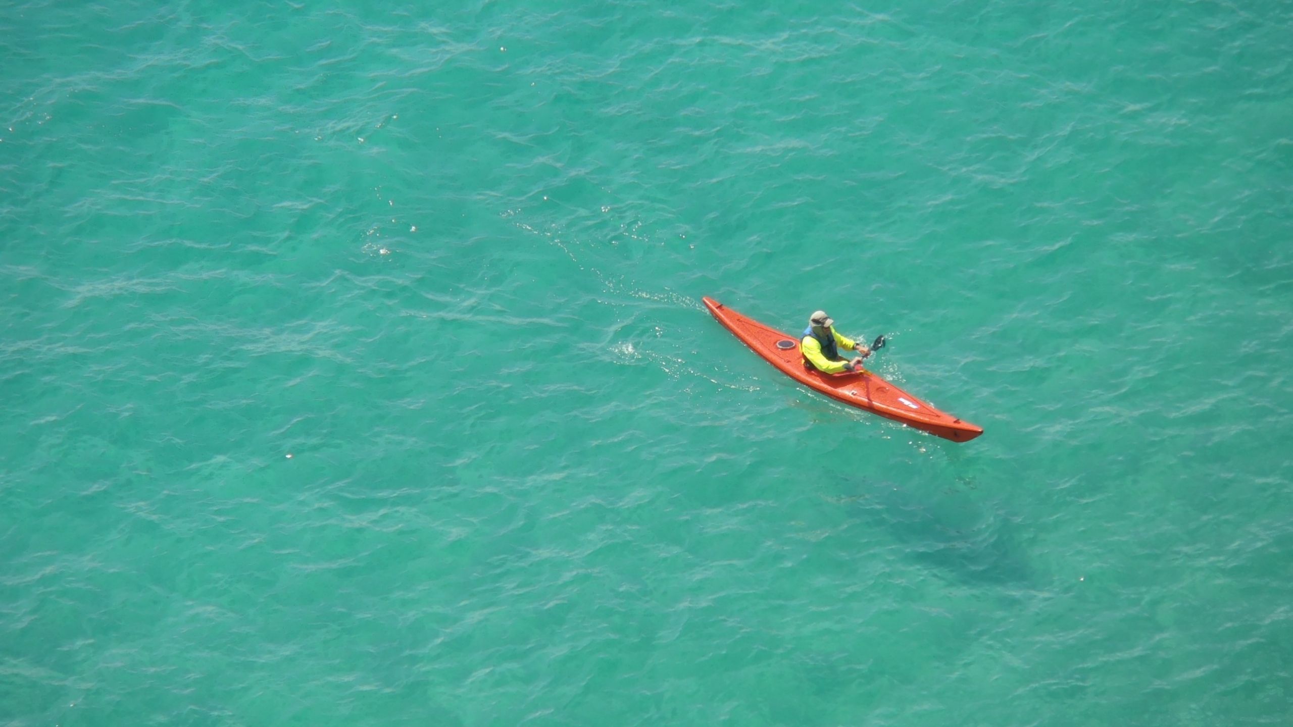Orange Kayak in the ocean at Tranquility Beach Beachfront Resort, in the Florida Keys.