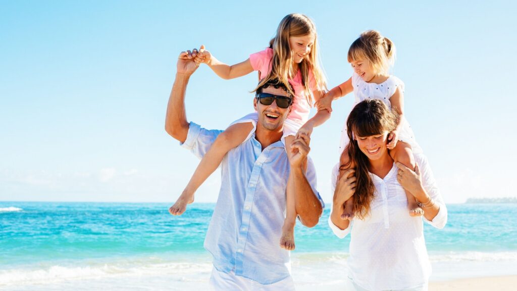 Family at the beach at Tranquility Bay Beachfront Resort, in the Florida Keys.