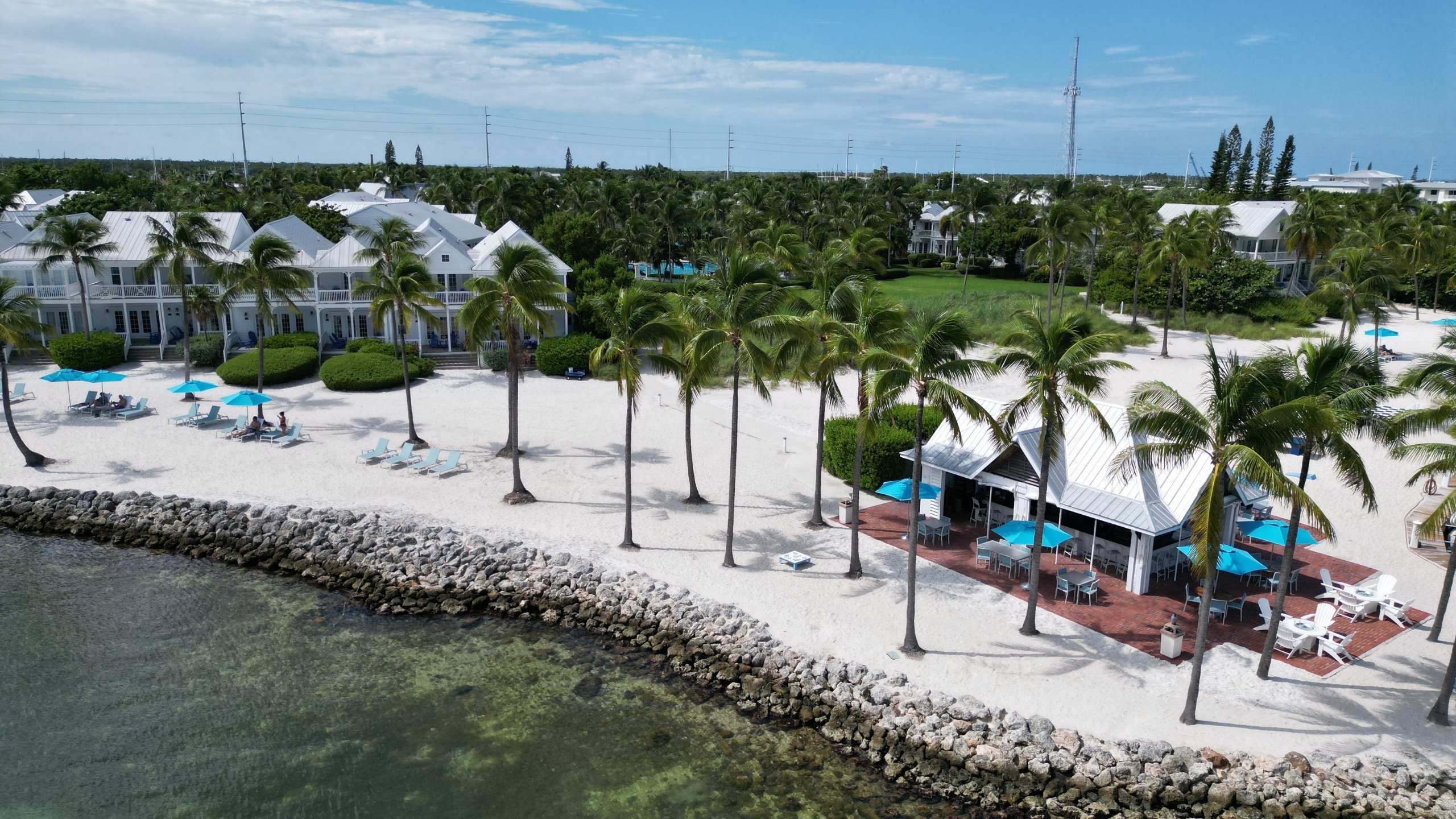 Aerial view of TJ's Tiki Bar and private beach at Tranquility Bay Beachfront Resort, in Marathon, FL.
