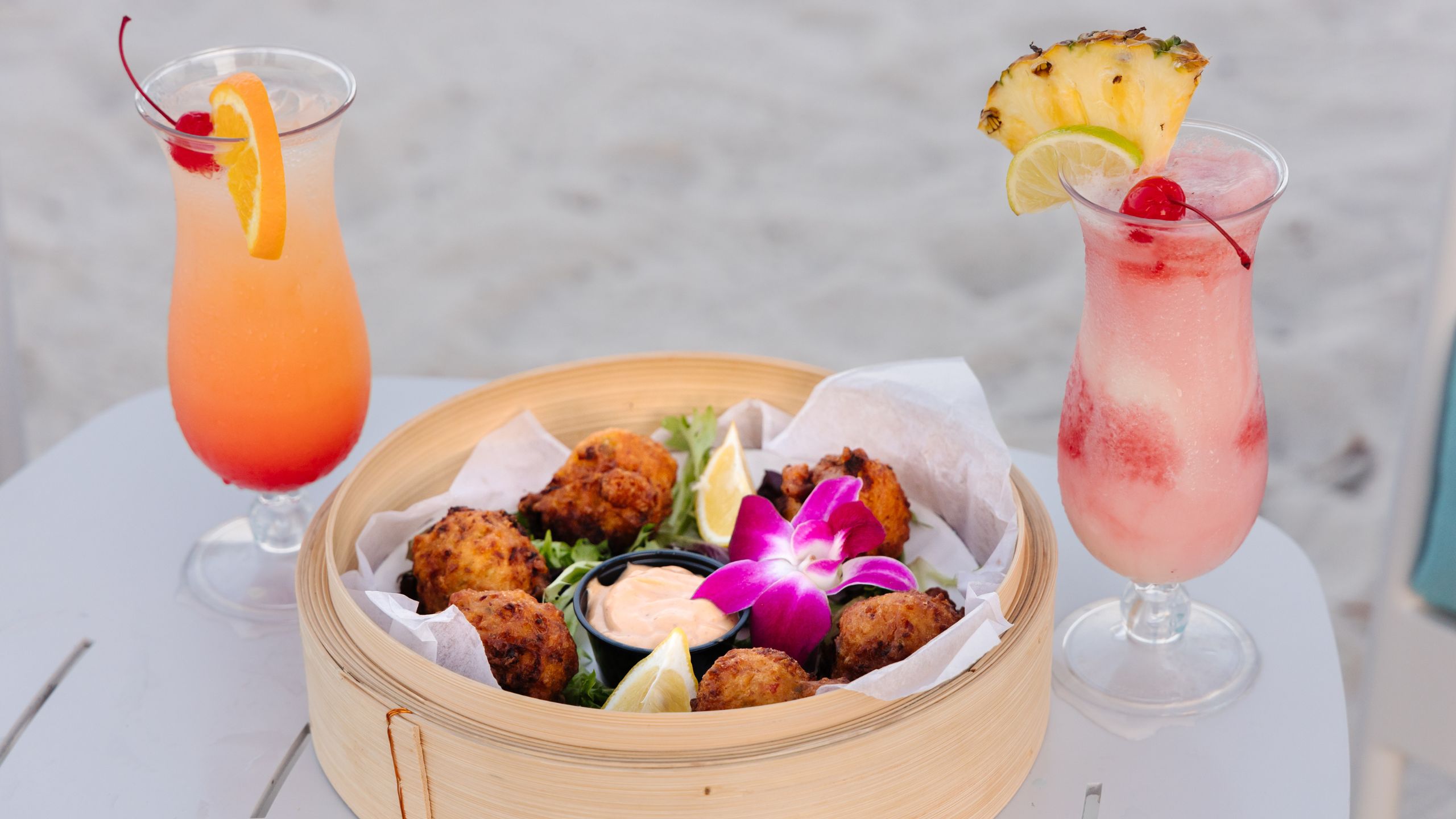 Plated dish and drinks at Tj's Tiki Bar at Tranquility Bay Beachfront Resort, in the Florida Keys.