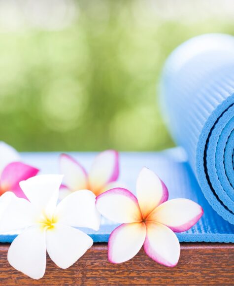 A yoga mat and tropical flowers at Tranquility Bay Beachfront Resort, in the Florida Keys.