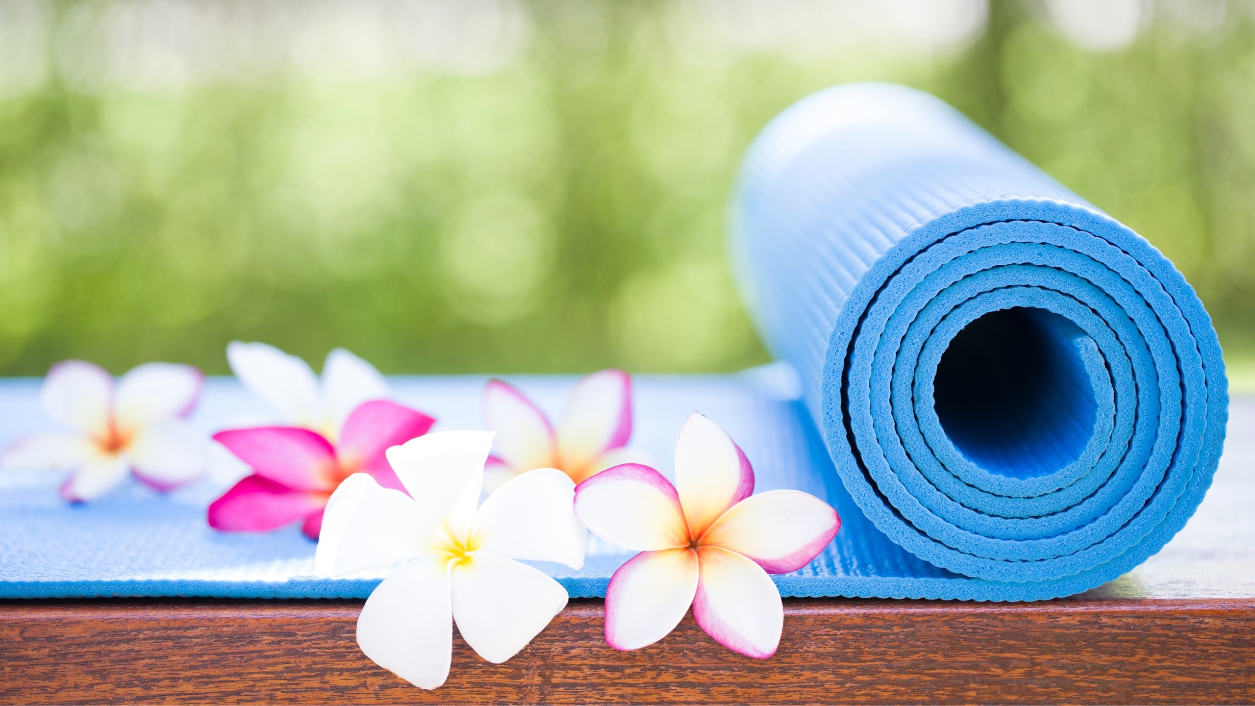 A yoga mat and tropical flowers at Tranquility Bay Beachfront Resort, in the Florida Keys.