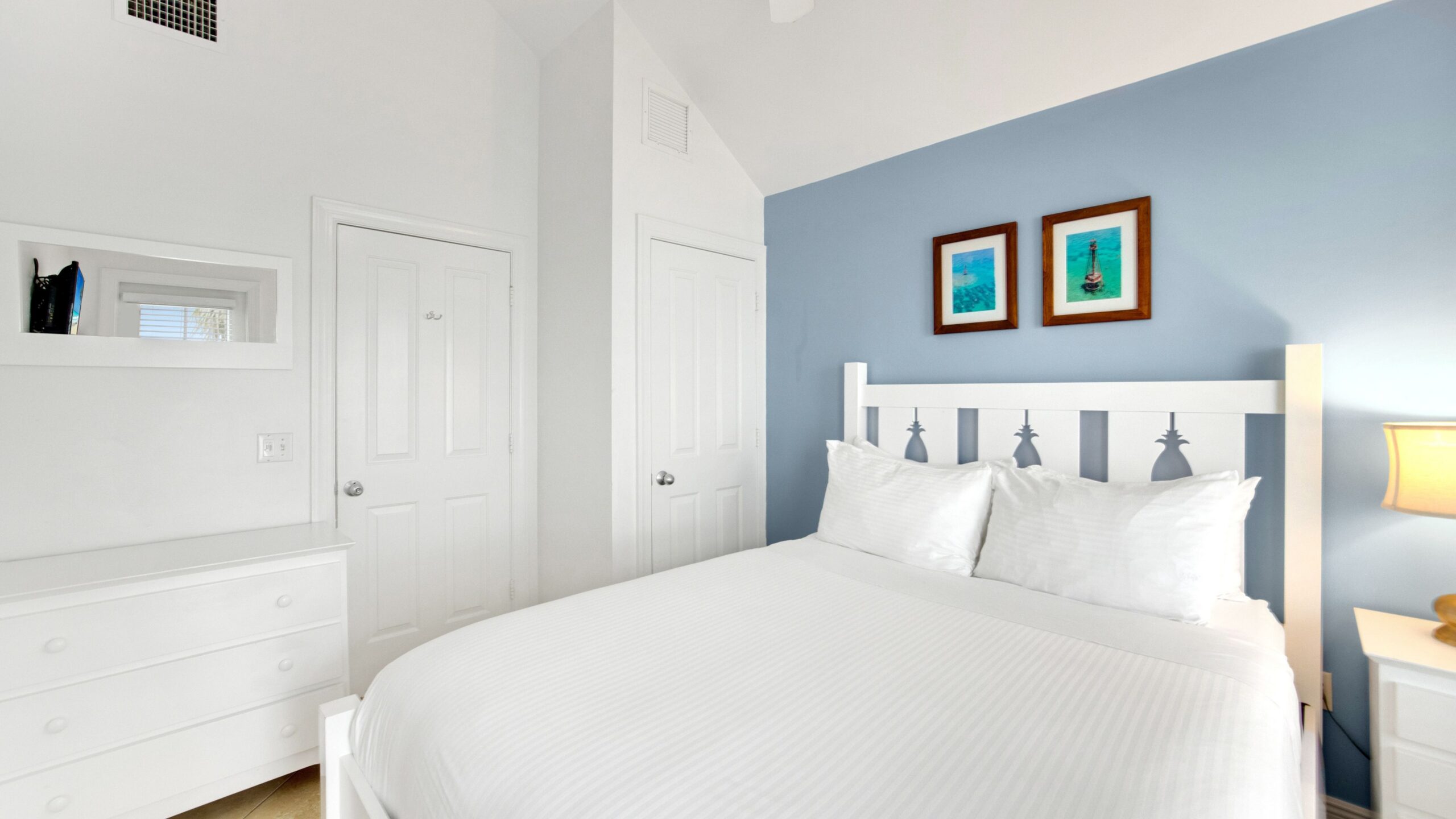 A queen bedroom in a 3-Bedroom Waterview Villa at Tranquility Bay Beachfront Resort, in Marathon, FL.