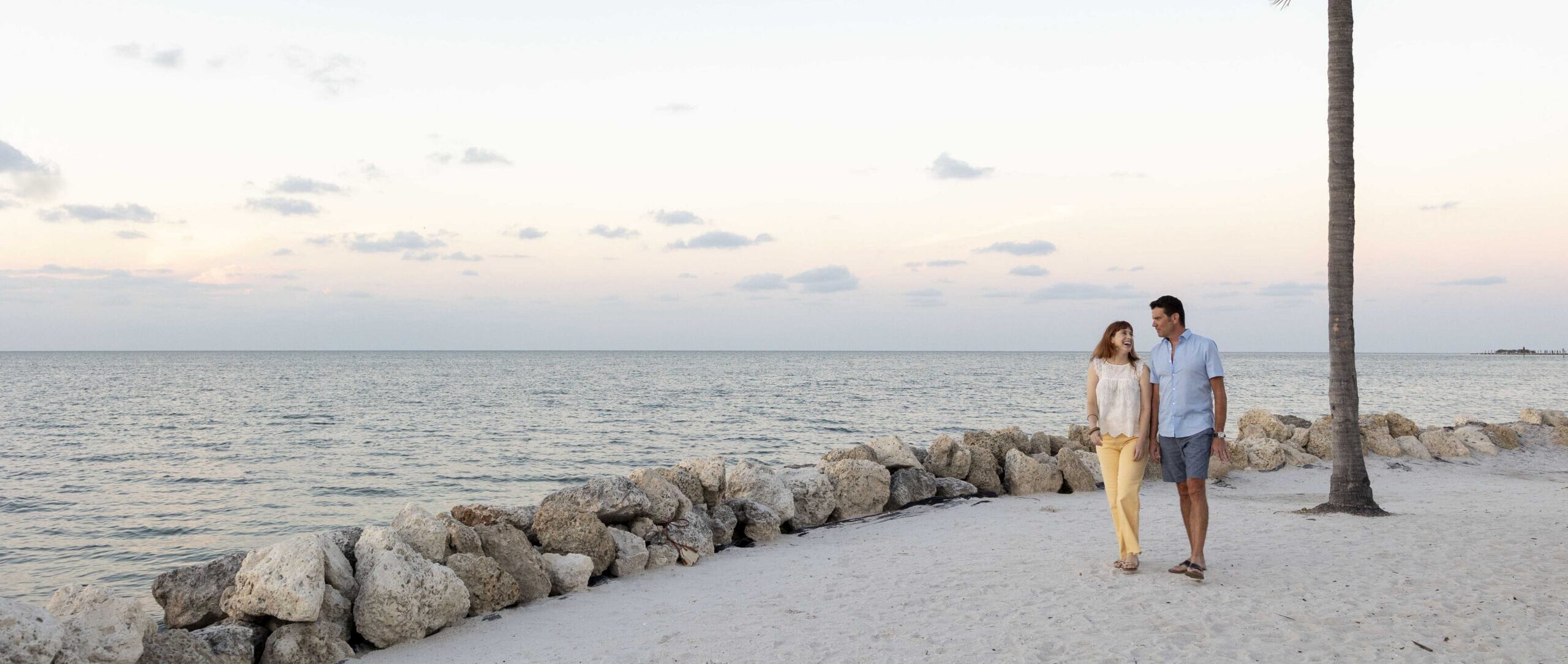 a couple taking a romantic walk on the beach