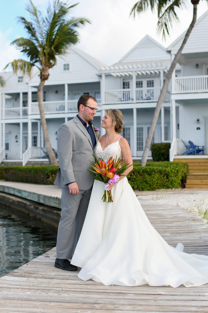 A couple taking their wedding photos at Tranquility Bay Beachfront Resort, in the Florida Keys.